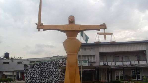 American_Woman_Jailed_For_-Pinging-_In_A_Federal_High_Court_In_Lagos_b60fd95a62584abf2cc1a667b058df31Waploaded.com_.jpg
